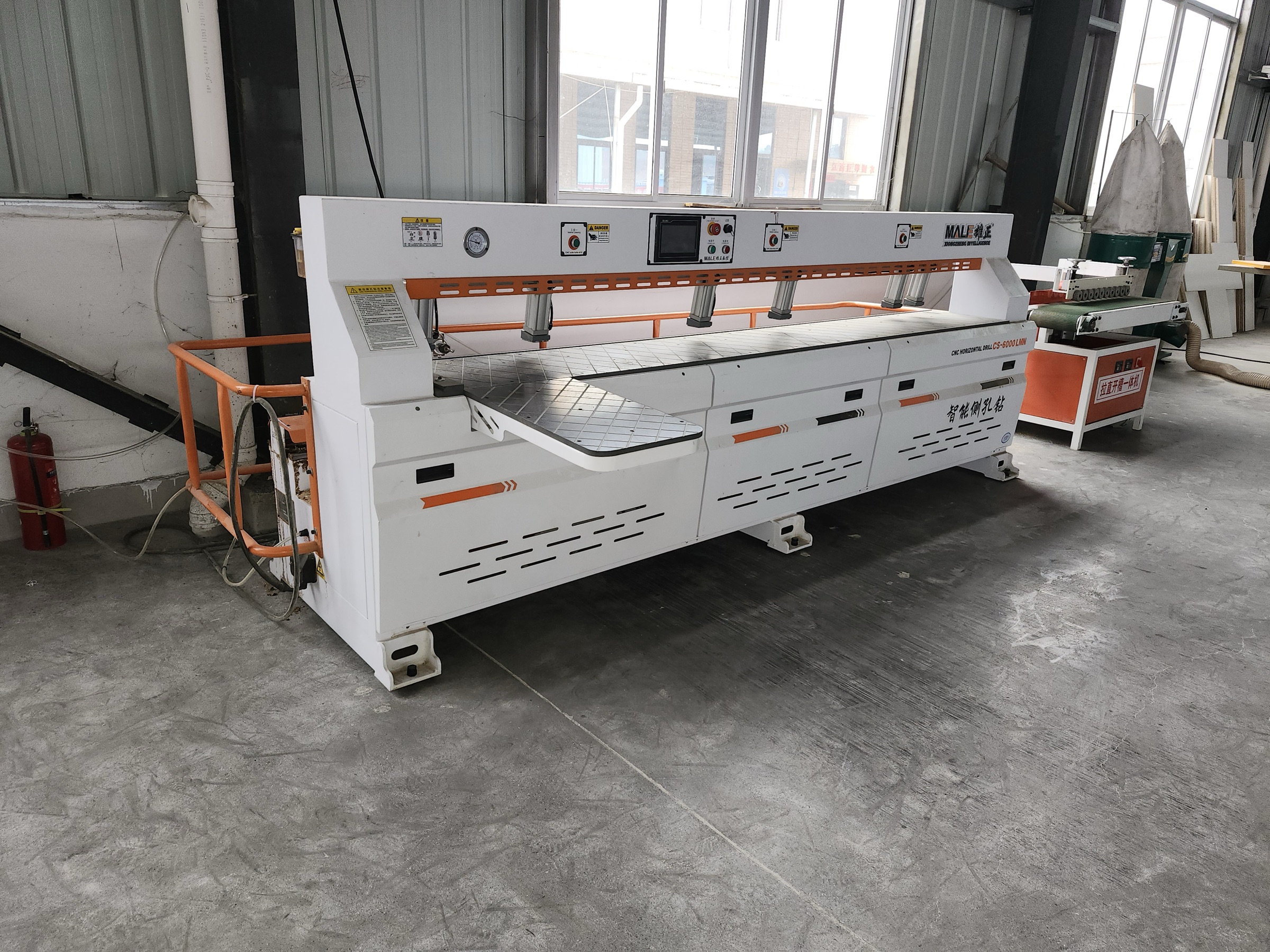 Horizontal panel drilling machine on the production floor