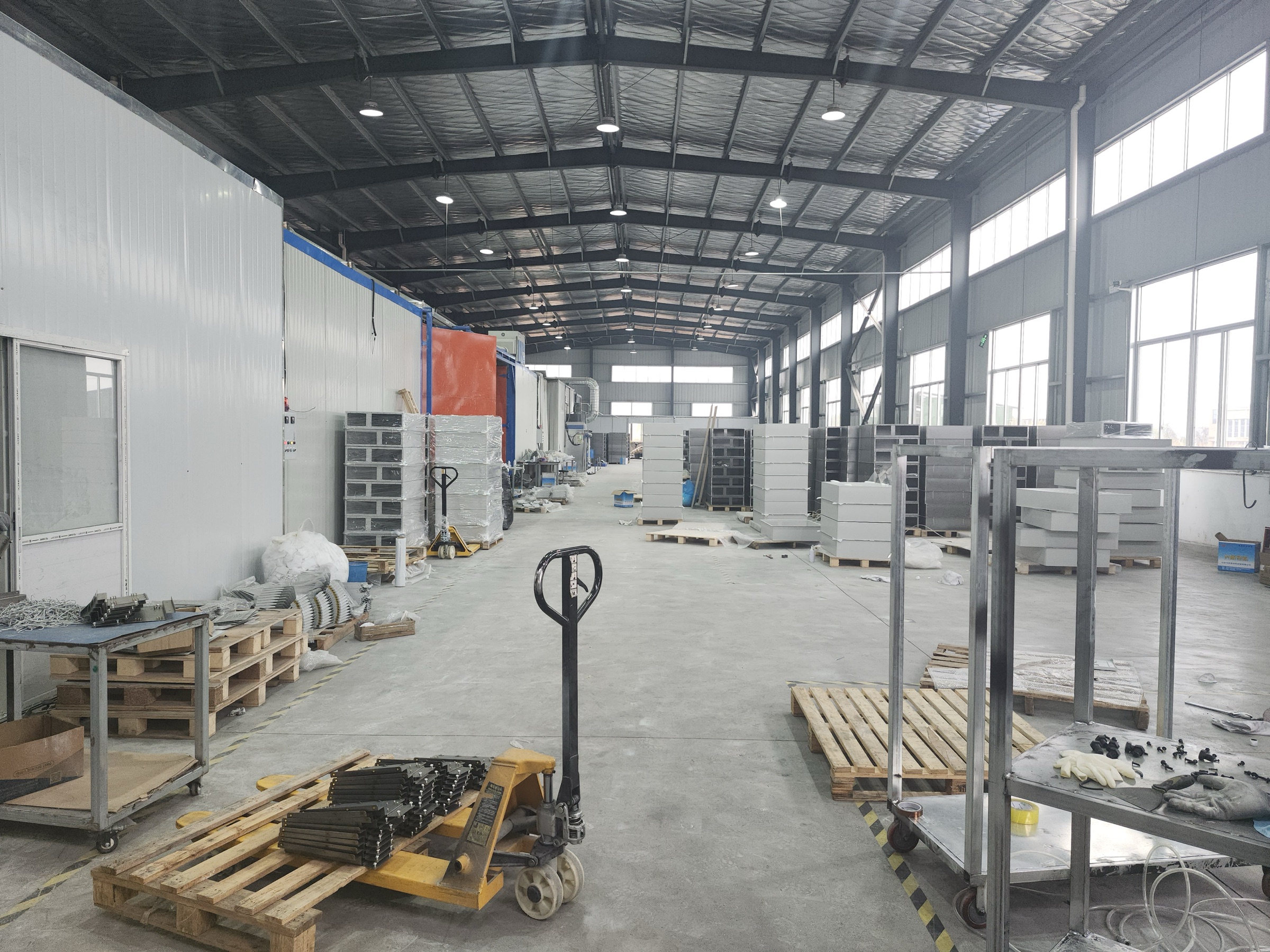 Laboratory furniture cabinet bodies and components staged in the production workshop