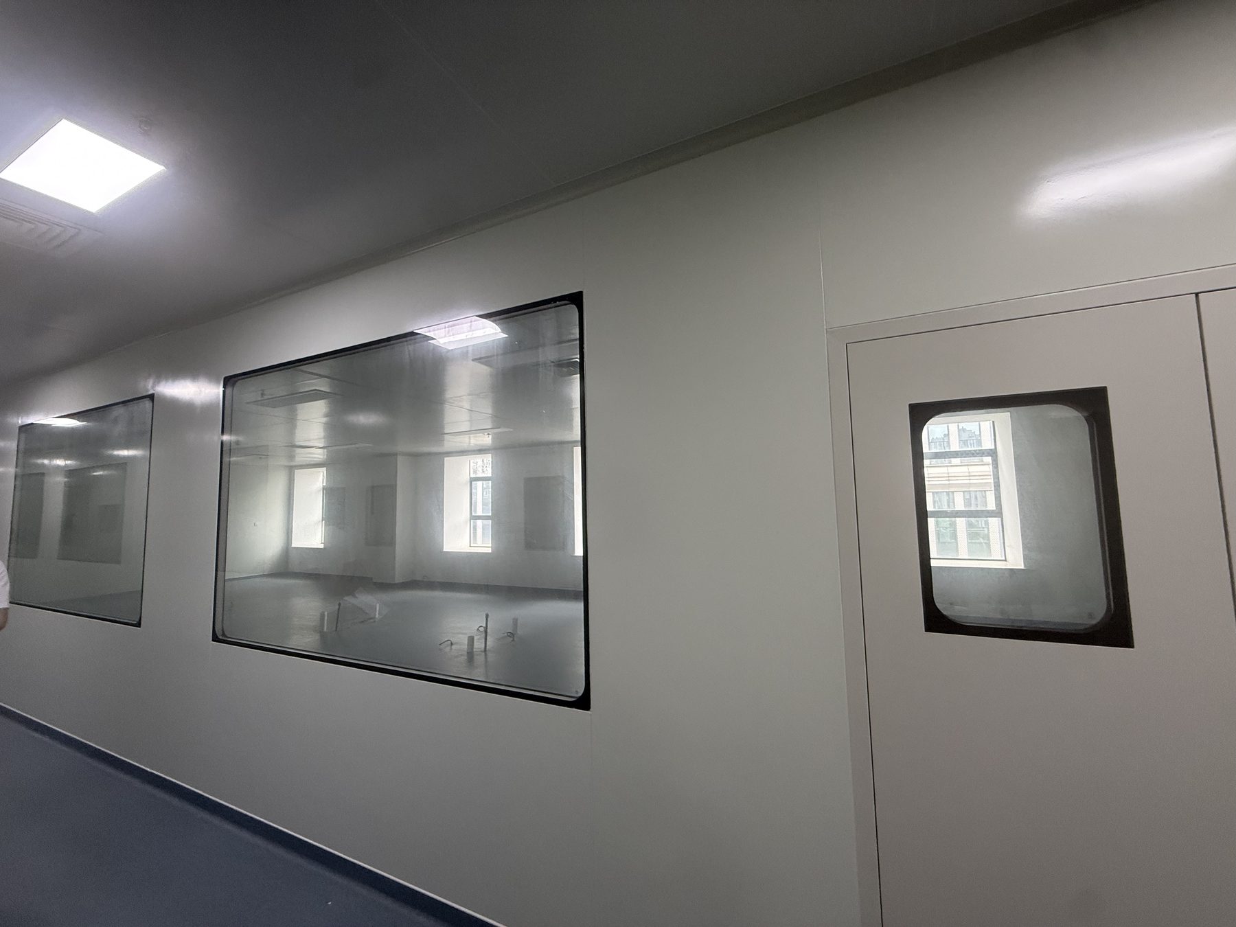 Cleanroom laboratory with island bench and fume hood