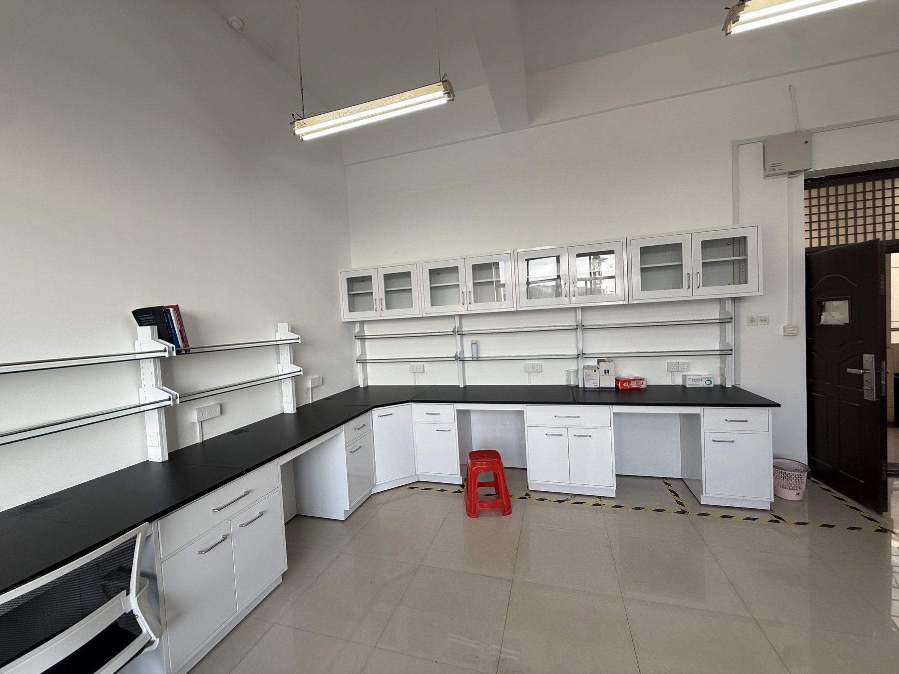 Laboratory wall benches with under-bench storage and glazed upper cabinets