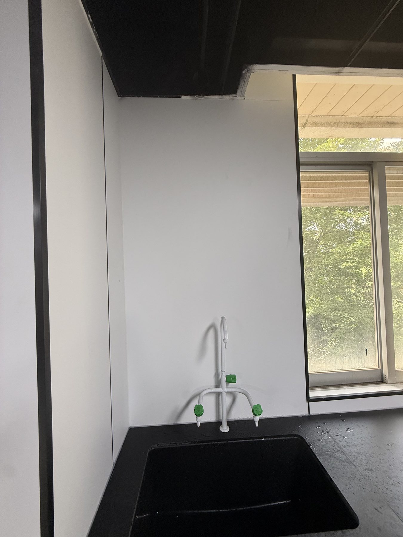 Quality testing laboratory sink and black worktop