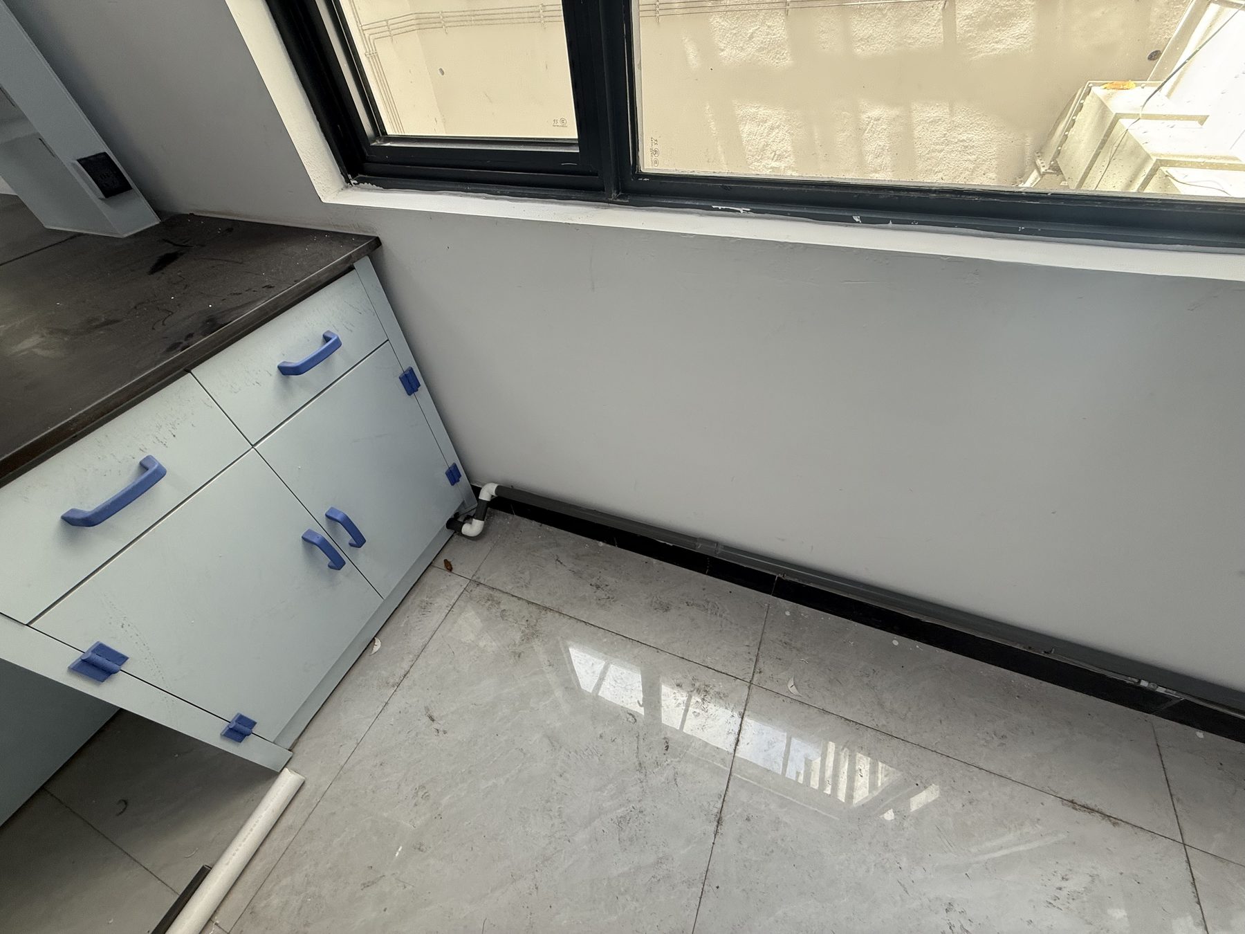 Blue laboratory base cabinets and utility connection