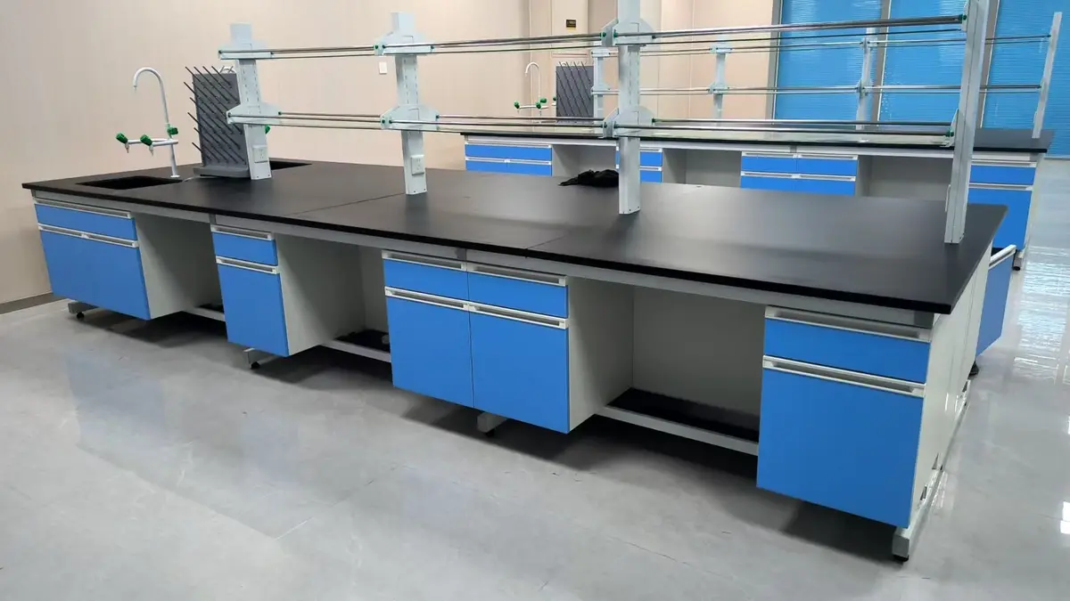 Blue chemistry island bench with black worktop